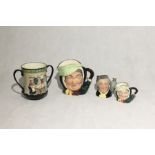 A collection of Royal Doulton character jugs and a loving cup including "Pottery in the Past" D