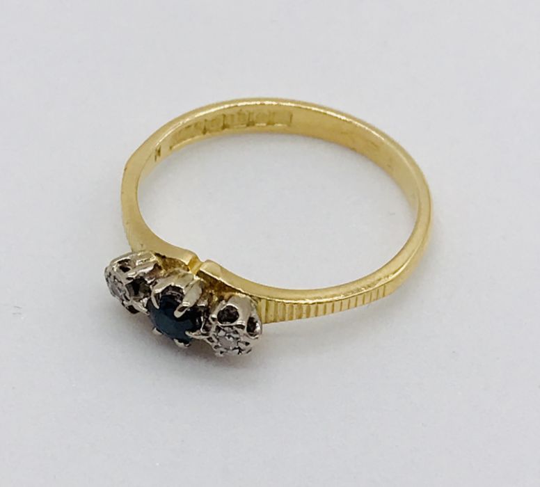 A diamond and sapphire three stone ring set in 18ct gold - Image 2 of 2