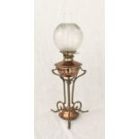 An Arts and Crafts copper and brass oil lamp, in the manner of W A S Benson, circa 1900, with a