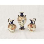 A pair of Royal Crown Derby jugs and vase in the Imari pattern