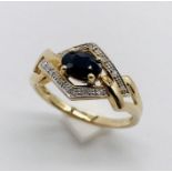 A 9ct gold diamond and sapphire dress ring