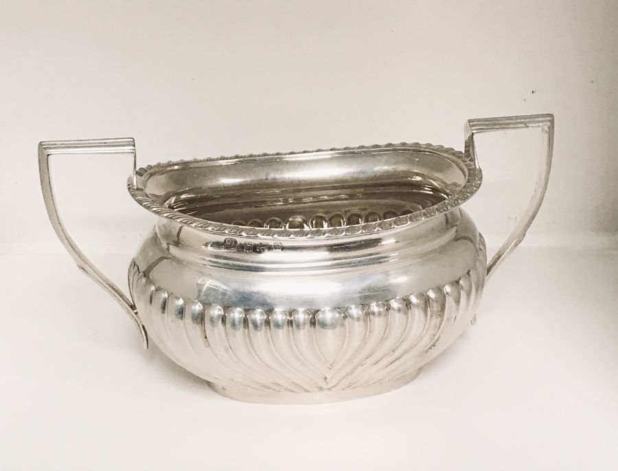 A hallmarked silver two handled sugar bowl, weight 295.2g ( 9.49 troy ounces)