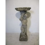 A weathered concrete bird bath the base formed as a Cherub, height 87cm