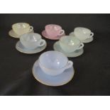 An Arcopol part tea set with 6 multi coloured cups and saucers