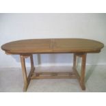 A Indonesian teak, large extending garden table. 180cm x 100cm, height 75cm extends to 240cm