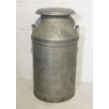 A two handled milk churn stamped "Unigate Creameries Ltd"