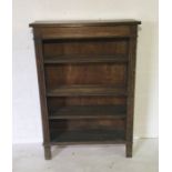 An antique oak bookcase with four shelves