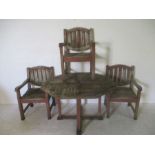 A set of Cachet wooden garden furniture, including a table and three carver chairs.