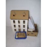 An unfinished modern dolls house with factory fitted electrics and accessories including doors,