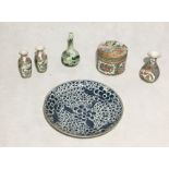 A collection of Oriental china including three Famille Rose vases and a lidded pot