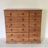 A modern pine chest of 12 drawers H188cm W114cm D42cm