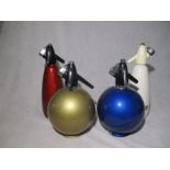 A collection of four vintage soda siphons