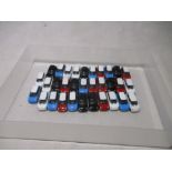 A collection of small cars for a Bachmann OO gauge model railway twin car transporter