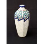 A Longwy French Art Deco vase decorated with stylised motifs on a crackled cream ground, height