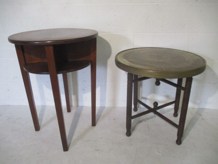 A Middle Eastern brass top table plus one other.