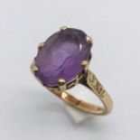 A 9 ct gold ring set with an amethyst