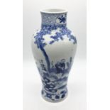 A Chinese blue and white vase decorated with scenes of Acrobats, tightrope walker, jugglers etc.