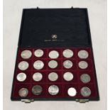 A collection of coins including silver including a George III bank token 1813, George V Newfoundland
