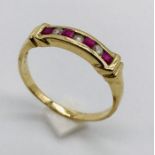 A diamond and ruby seven stone ring set in 9ct gold