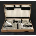 A collection of long vintage crystal drops in a canteen box