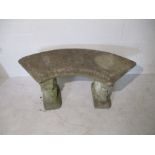 A curved concrete garden bench - A/F