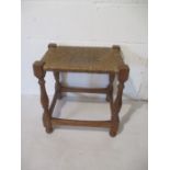 An Arts & Crafts rush seated stool