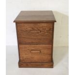 A vintage oak two drawer filing cabinet