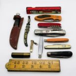 A collection of penknives, lighter etc.
