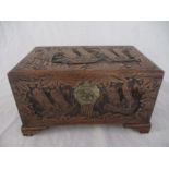 An Eastern box carved with scenes of Junks sailing, width 39cm