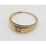 A worn 18ct gold ring set with a single diamond, weight 2.9g