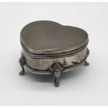 A hallmarked silver heart shaped trinket box