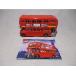 An unboxed completed LEGO Creator London Bus (10258) with instruction booklet