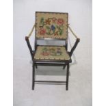 A Victorian ebonised folding chair.