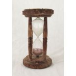 A large wooden framed hour timer, height 33cm