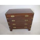 A mahogany campaign chest of four drawers