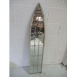 A Gothic arched mirror with wire decoration