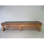 A large industrial wooden bench from the Axminster Carpets Factory, 257cm x 60cm, height 56cm