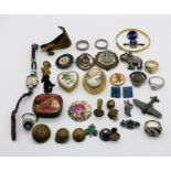 A collection of costume jewellery, badges etc.