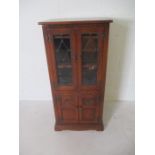 An oak Old Charm cabinet with cupboard under