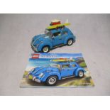 An unboxed completed LEGO Creator Expert Volkswagen Beetle (10252) with instruction booklet