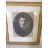 A printed portrait of a gentleman, indistinct signature, in a gilt frame. 86cm x 75cm.