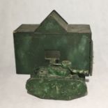 A handmade wooden army tank and matching garage