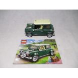 An unboxed completed LEGO Creator Expert Mini Cooper (10242) with instruction booklet