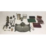 A collection of interesting items including a miniature tin containing a seal, autograph albums,