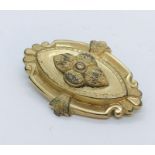 An unmarked gold Etruscan style brooch, weight 3.9g