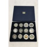 A tray of coins including silver comprising of Seychelles 5 Rupees 2000, Isle of Man Moscow Olympics