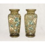 A pair of turn of the century large glass vases with hand painted floral decoration