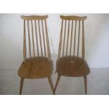 A pair of stickback Ercol chairs.