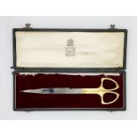A cased set of ceremonial scissors by Toye & Co. Silver plaque to top inscribed "Presented to Her