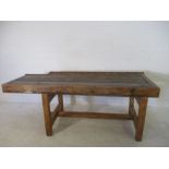 A rustic kitchen table made from a workbench